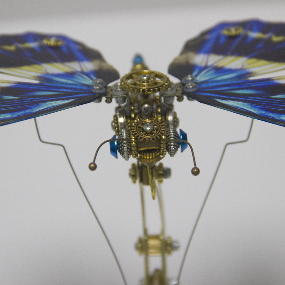 Rompecabezas mecánico de metal Steampunk con diseño de mariposa y caja de música.